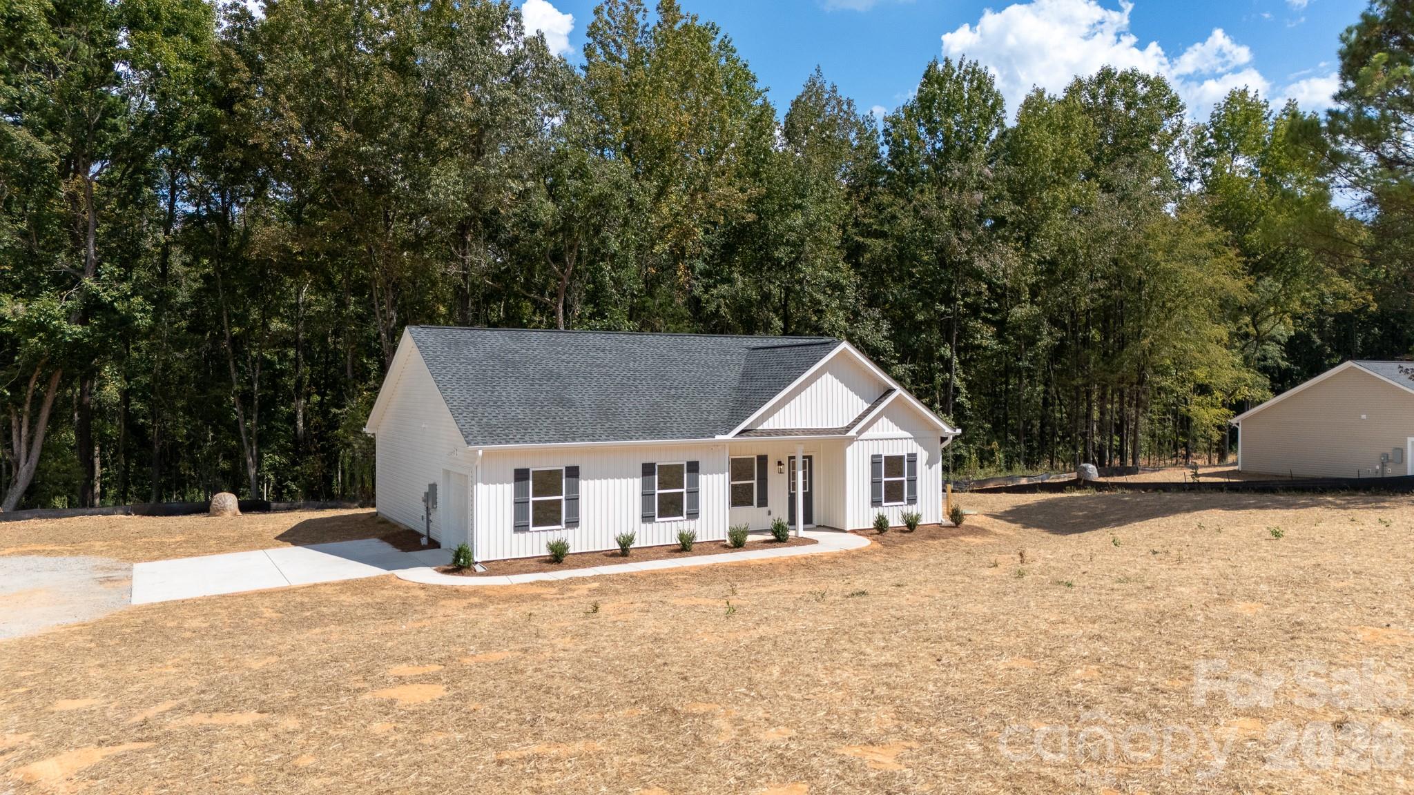 3339 Lesslie Highway, Unit 2 Rock Hill, SC 29730 - Photo 4 of 46 a white house with a large tree in front of it