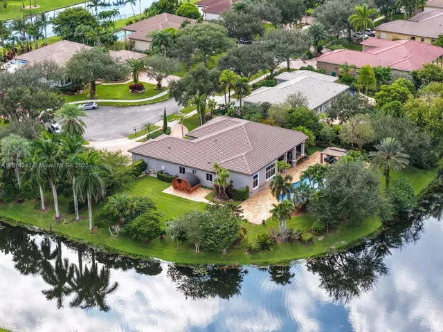 an aerial view of house with yard swimming pool and outdoor seating