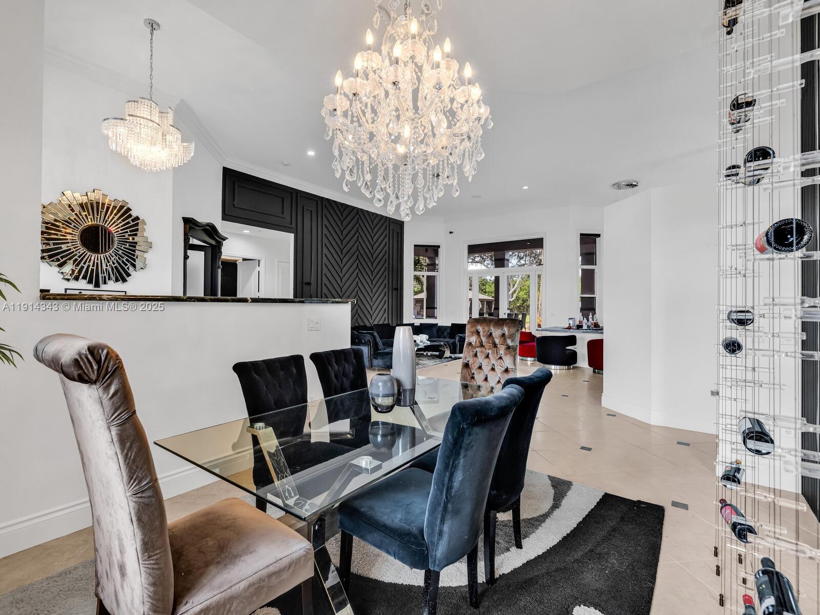 12995 Southwest 40 Street Davie, FL 33330 - Photo 24 of 79 a view of a dining room with furniture and chandelier