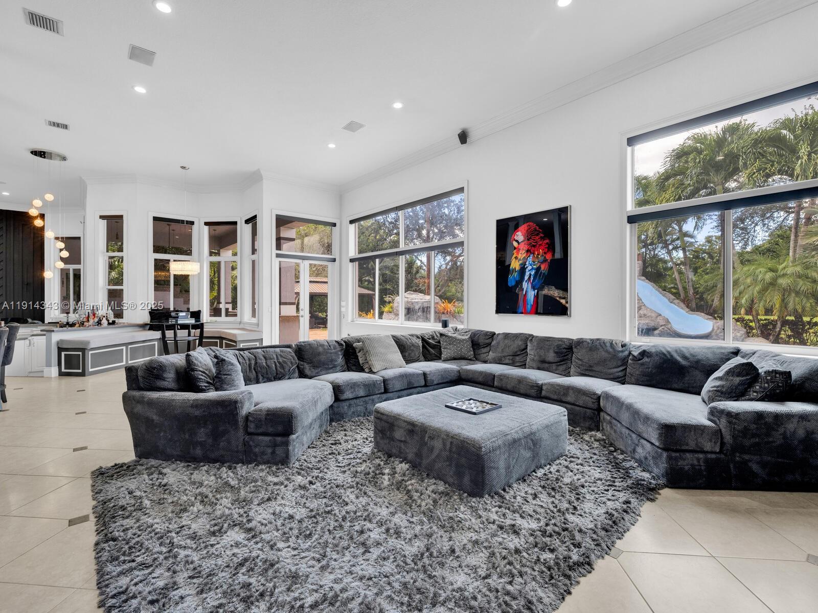 12995 Southwest 40 Street Davie, FL 33330 - Photo 31 of 79 a living room with furniture and a large window