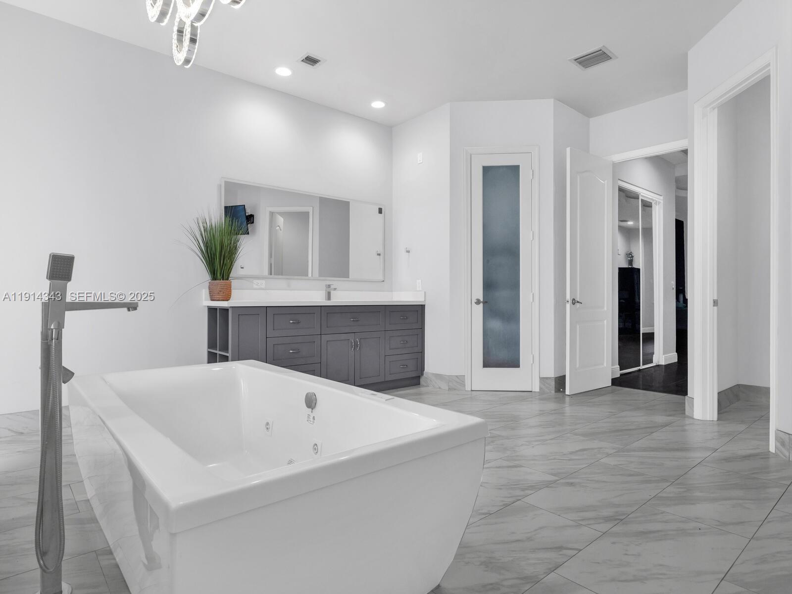 12995 Southwest 40 Street Davie, FL 33330 - Photo 40 of 79 Primary bathroom photoshopped white for your viewing options