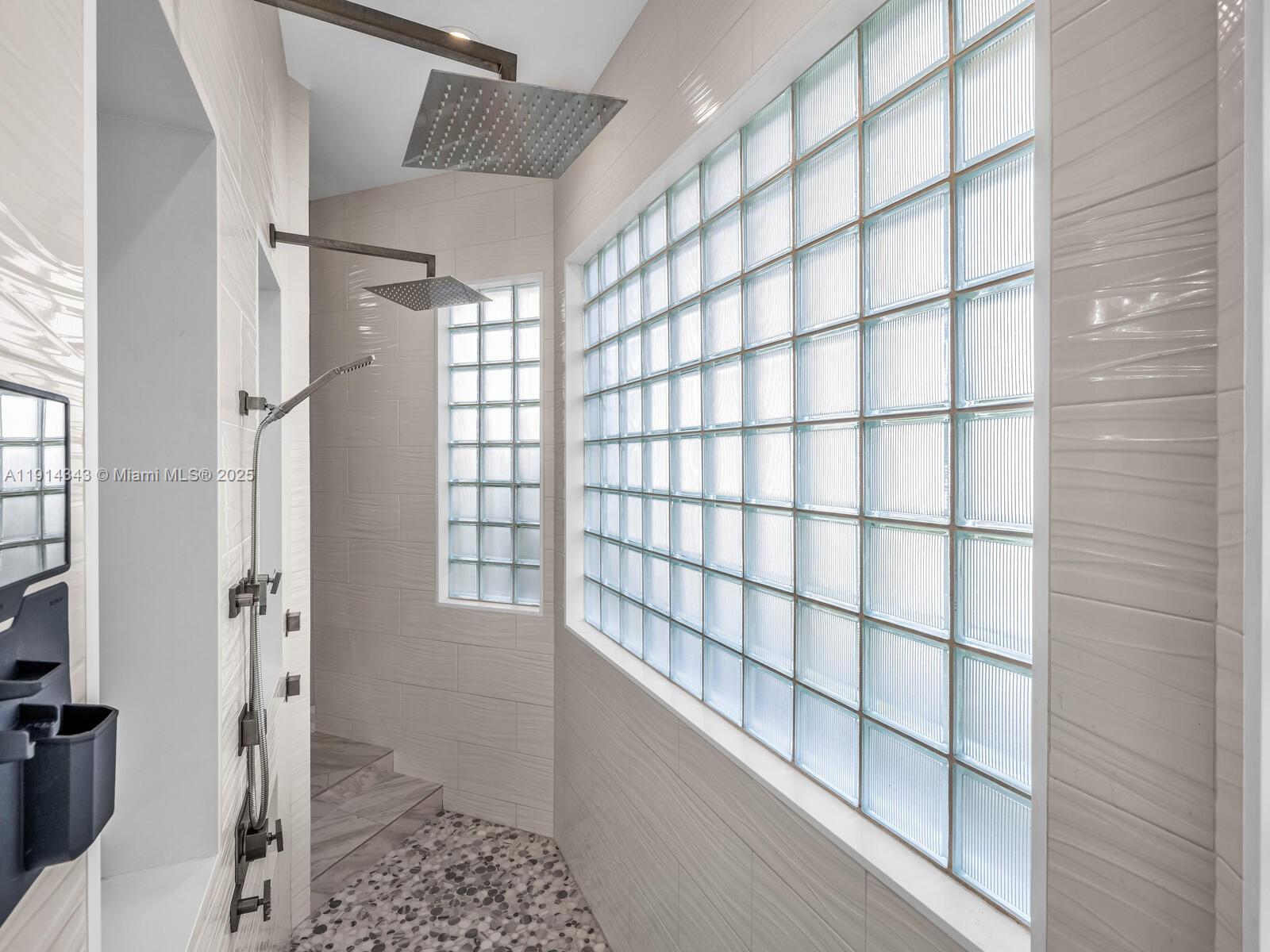 12995 Southwest 40 Street Davie, FL 33330 - Photo 41 of 79 a bathroom with a shower and a toilet