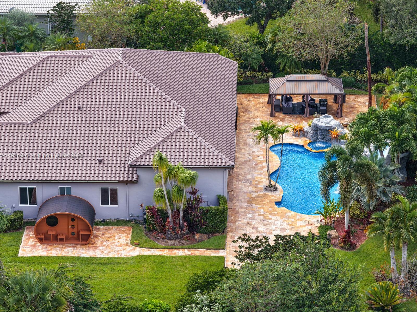 12995 Southwest 40 Street Davie, FL 33330 - Photo 5 of 79 a aerial view of a house with swimming pool and porch