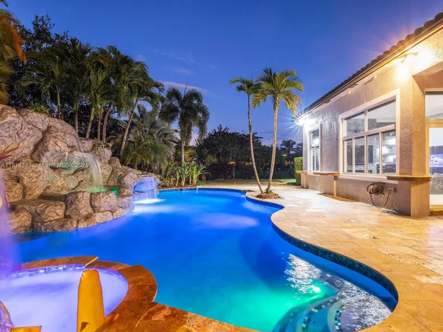 a view of a swimming pool with an outdoor seating