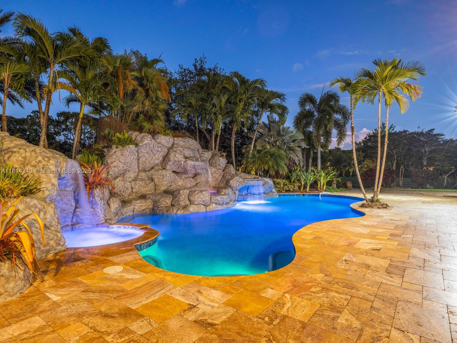 12995 Southwest 40 Street Davie, FL 33330 - Photo 66 of 79 a view of a swimming pool with a yard