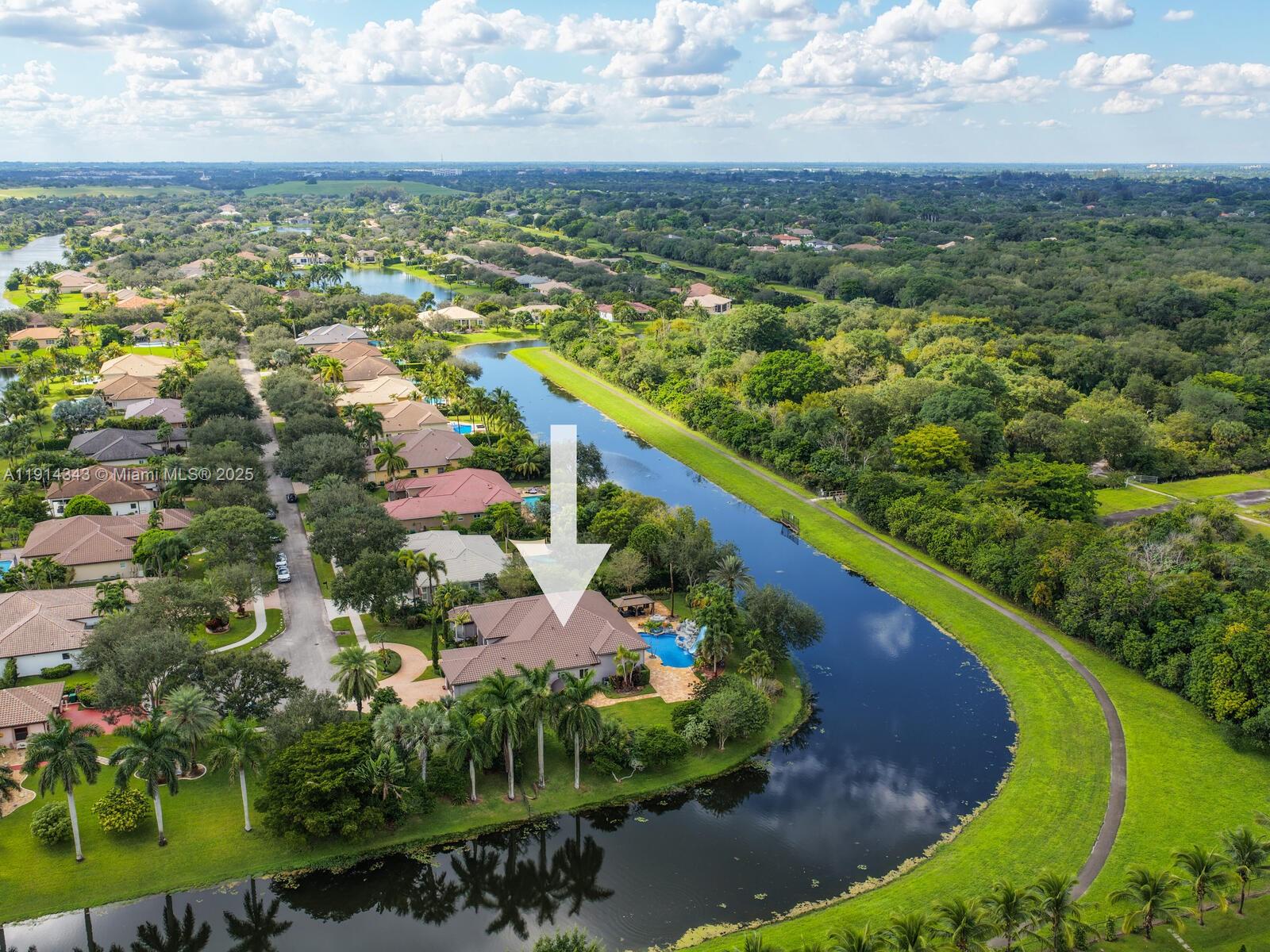 12995 Southwest 40 Street Davie, FL 33330 - Photo 74 of 79 an aerial view of residential houses with outdoor space and trees