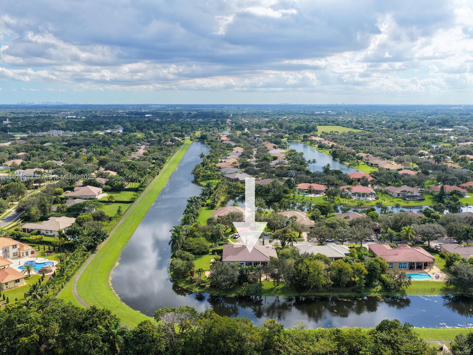 12995 Southwest 40 Street Davie, FL 33330 - Photo 76 of 79 an aerial view of residential houses with outdoor space and lake view in back