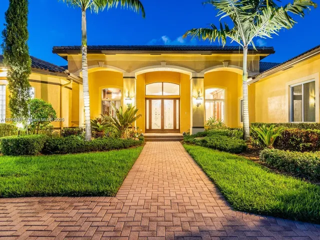 a view of a brick house with a large windows