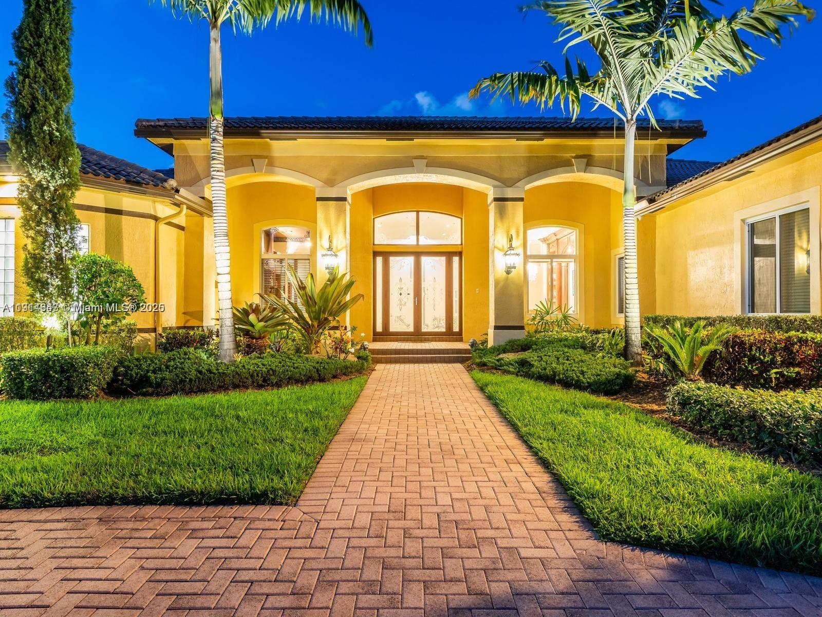 12995 Southwest 40 Street Davie, FL 33330 - Photo 9 of 79 a view of a brick house with a large windows