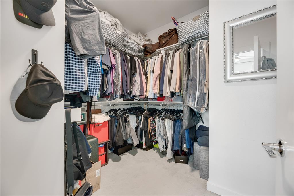 4705 Bryan Street, Unit 302 Dallas, TX 75204 - Photo 27 of 28 a view of walk in closet with clothes and shoes