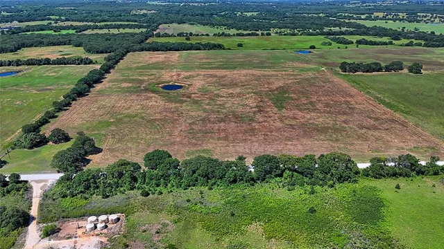an aerial view of a golf course with a garden