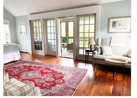 a bathroom with a sink a mirror and a shower