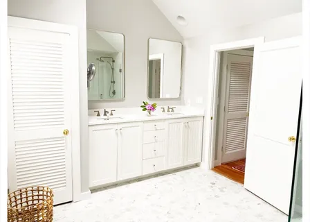a bathroom with a toilet sink and shower