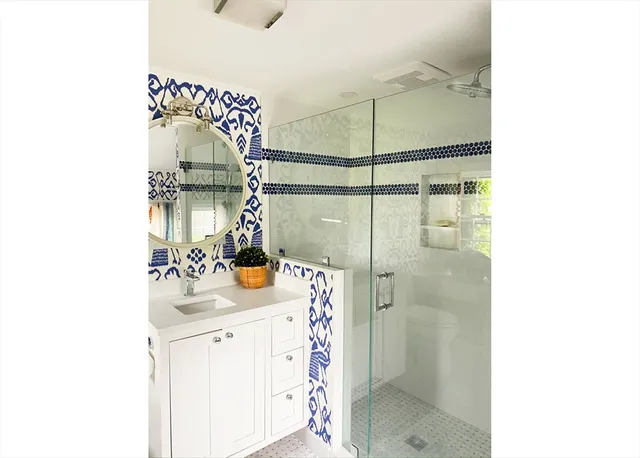 a bedroom with bed and windows