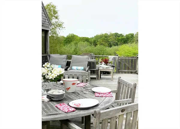 a outdoor dining space with furniture and garden view