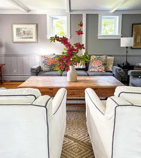 a living room with furniture and a table