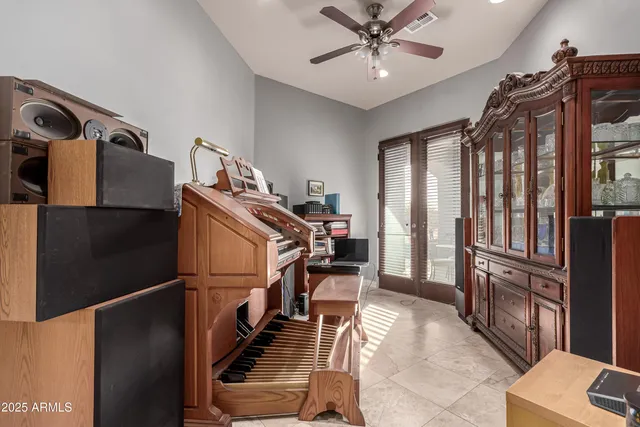 a view of a hallway with the entryway wooden floor and chandelier