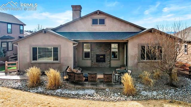 1118 Spectrum Loop Colorado Springs, CO 80921 - Photo 1 of 3 Unique Feature!! Dual-sided fireplace for Living room and Patio.