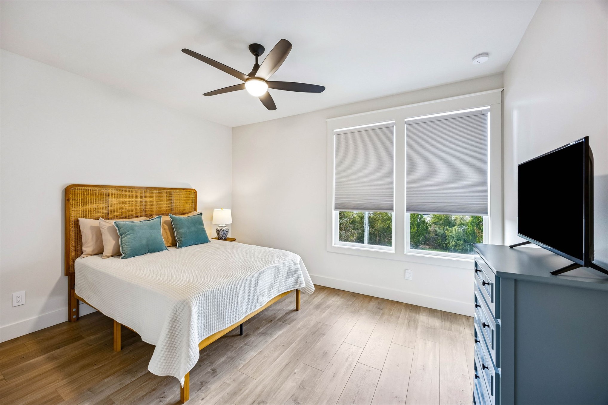 424 South 3rd Street Fernandina Beach, FL 32034 - Photo 24 of 38 a bedroom with a bed and a flat tv screen on dresser