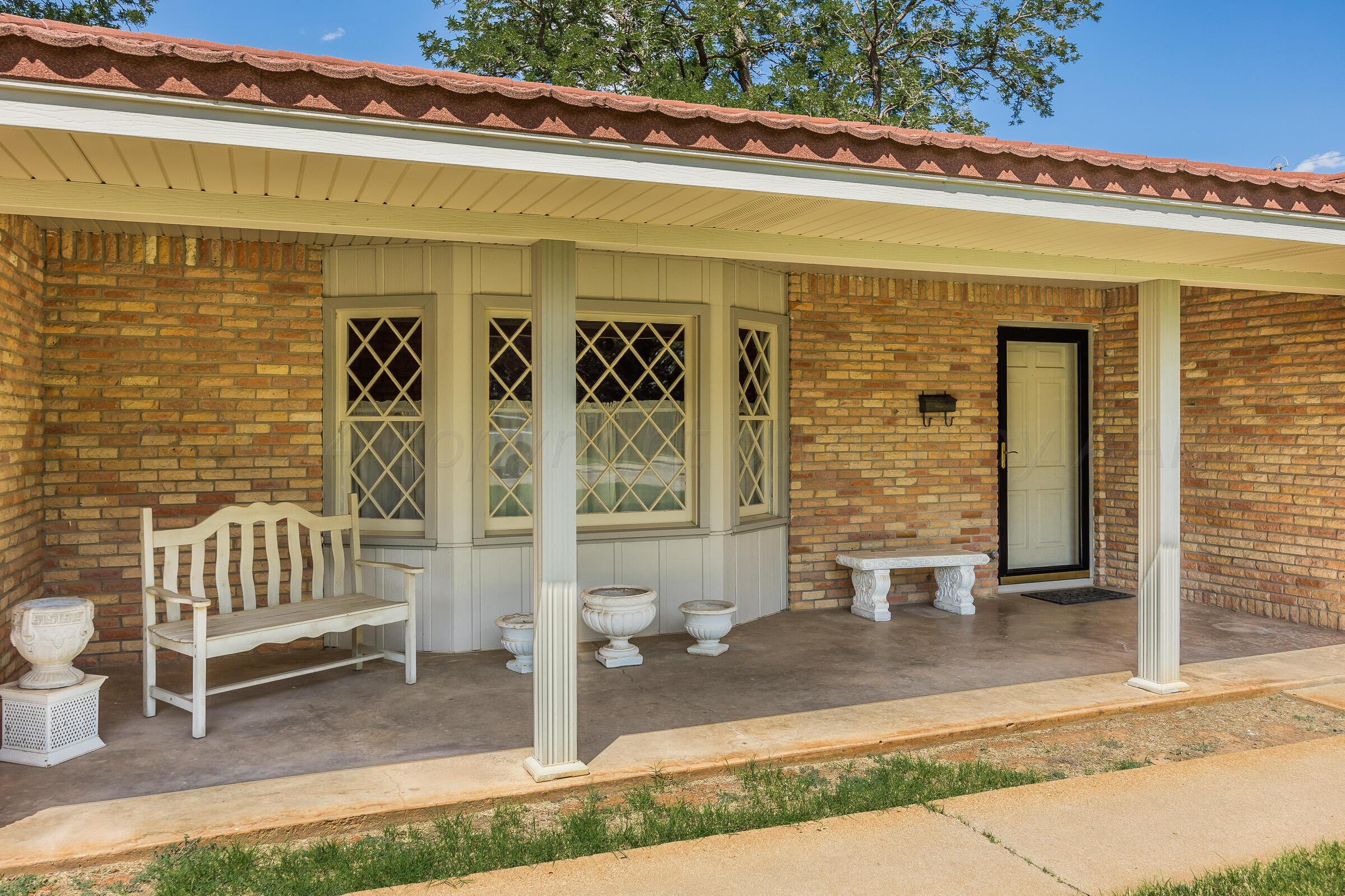 5502 Brinkman Drive Amarillo, TX 79106 - Photo 2 of 22 a front view of a building with glass windows