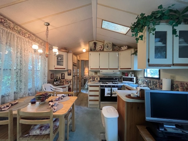 2795 East 28th Road Marseilles, IL 61341 - Photo 7 of 58 a kitchen with a sink stove and cabinets