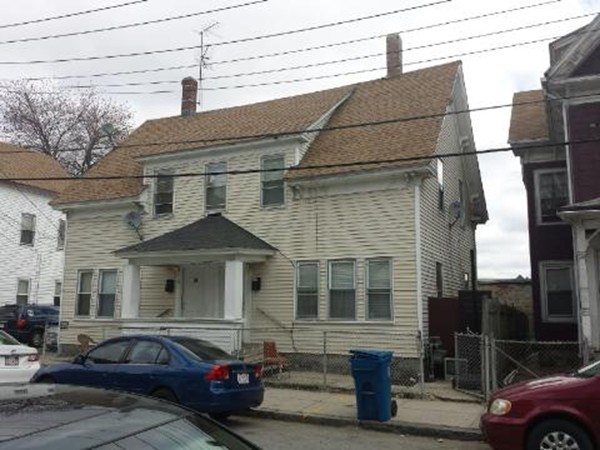 29-31 Washington Street Lawrence, MA 01841 - Photo 1 of 5 a front view of a house with cars parked