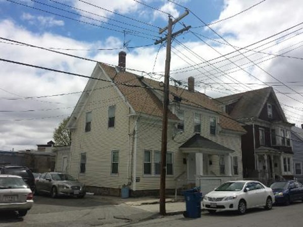 29-31 Washington Street Lawrence, MA 01841 - Photo 5 of 5 a car parked in front of a house