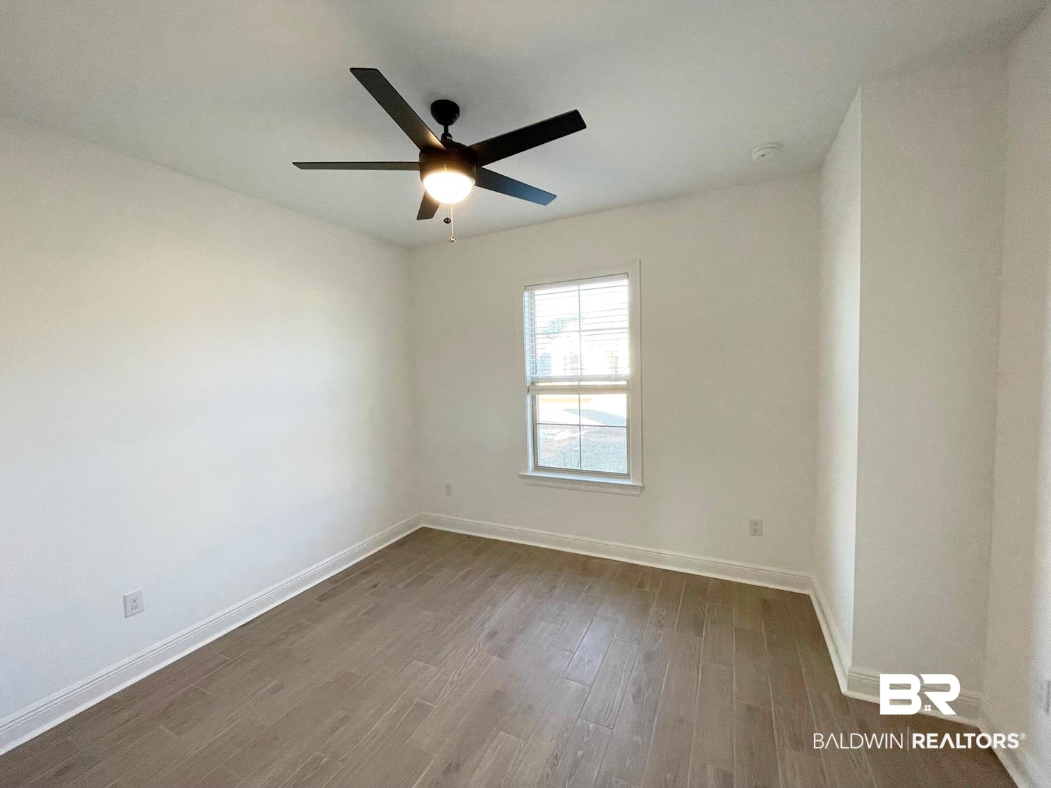1403 Fenton Circle Foley, AL 36535 - Photo 10 of 15 Empty room featuring hardwood / wood-style flooring and ceiling fan