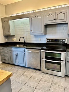 40 Village Road, Unit 1704 (PH4) Middleton, MA 01949 - Photo 11 of 35 a kitchen with stainless steel appliances granite countertop a stove and a sink