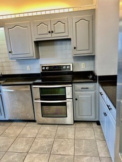 40 Village Road, Unit 1704 (PH4) Middleton, MA 01949 - Photo 12 of 35 a kitchen with stainless steel appliances granite countertop a stove and a sink