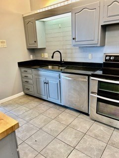 40 Village Road, Unit 1704 (PH4) Middleton, MA 01949 - Photo 13 of 35 a kitchen with a sink and cabinets