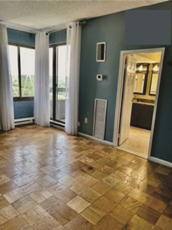 40 Village Road, Unit 1704 (PH4) Middleton, MA 01949 - Photo 19 of 35 a view of an empty room with window and refrigerator