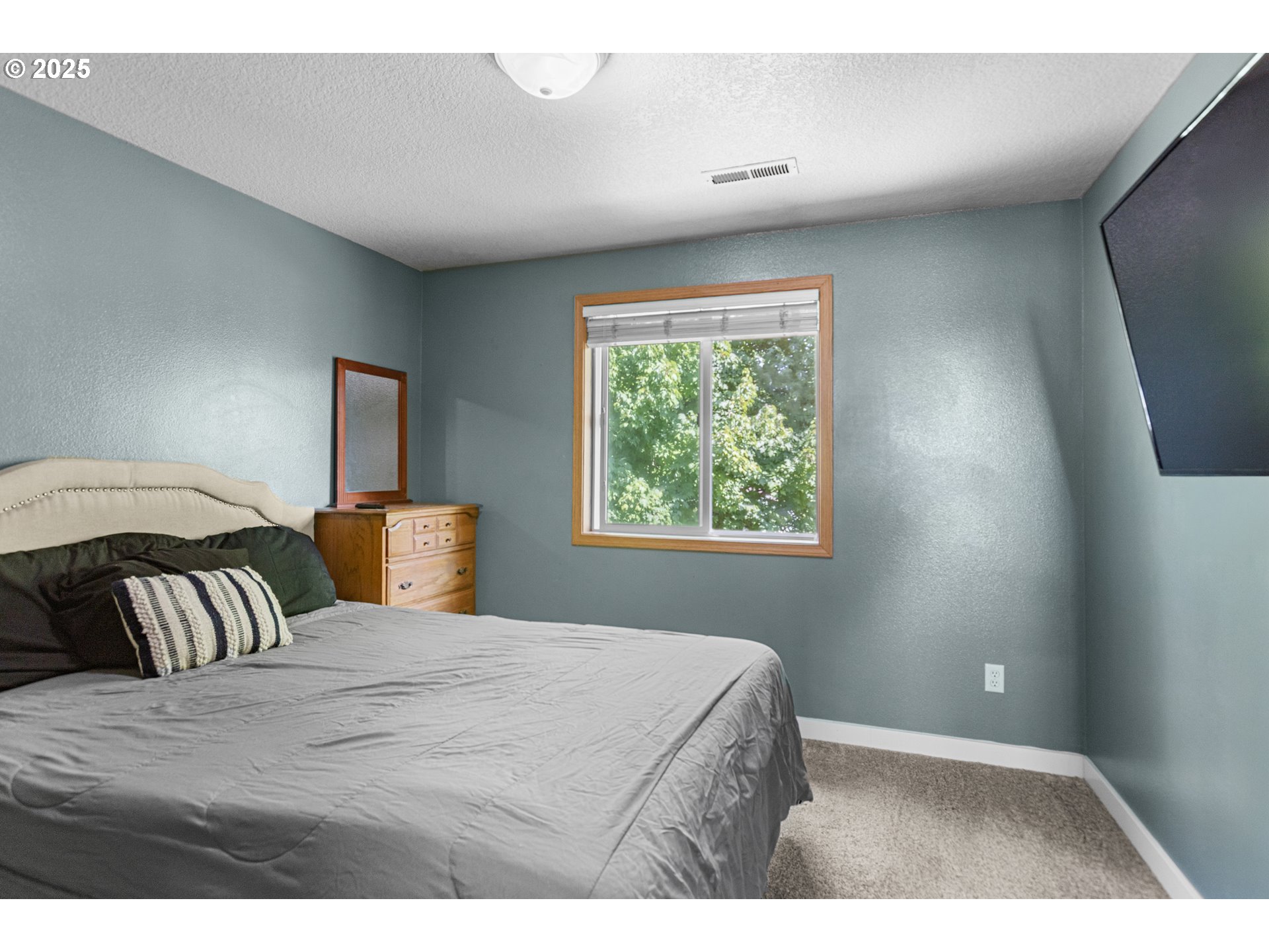 12 Southeast 9th Circle Battle Ground, WA 98604 - Photo 22 of 33 a bedroom with a bed and a night stand