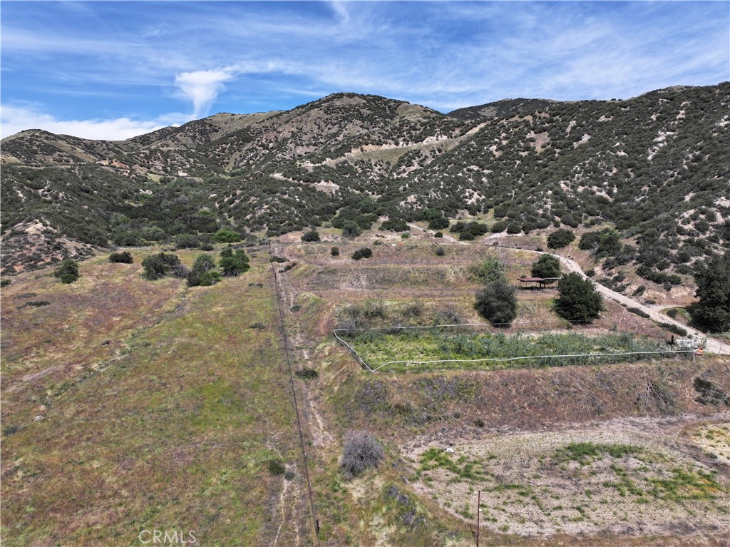 0 Wildwood Canyon Road Yucaipa, CA 92399 - Photo 1 of 12 a view of a dry yard with mountains in the background