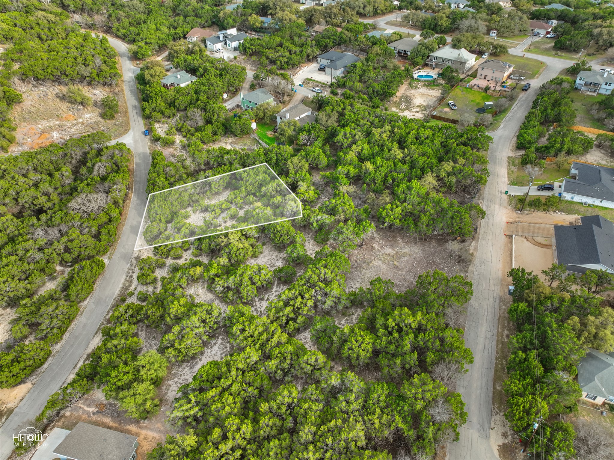 20705 Oak Ridge Lago Vista, TX 78645 - Photo 11 of 11 an aerial view of a residential houses with yard and trees