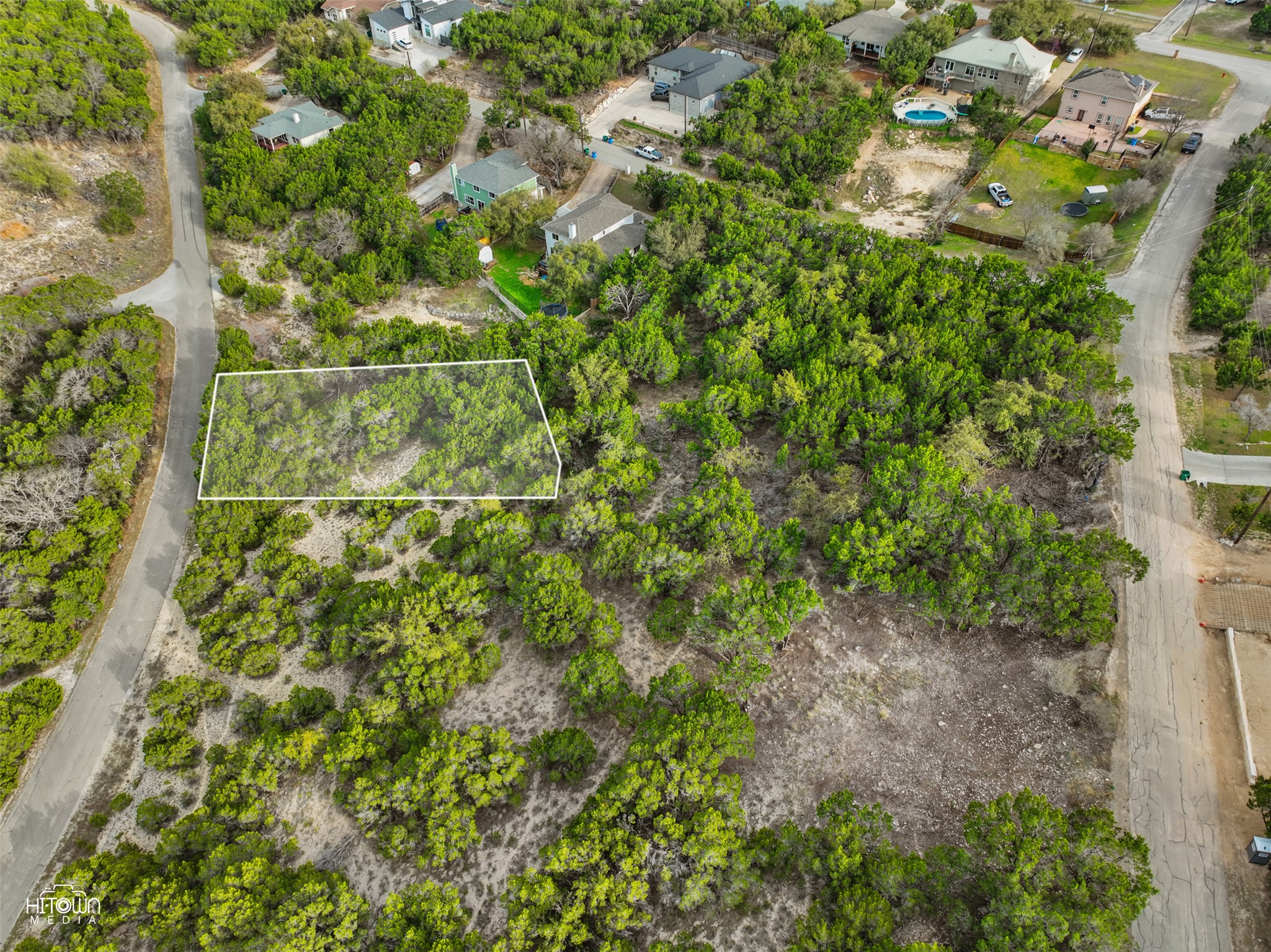 20705 Oak Ridge Lago Vista, TX 78645 - Photo 6 of 11 a backyard of a house with lots of green space and trees