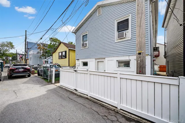 a view of a car park in front of house