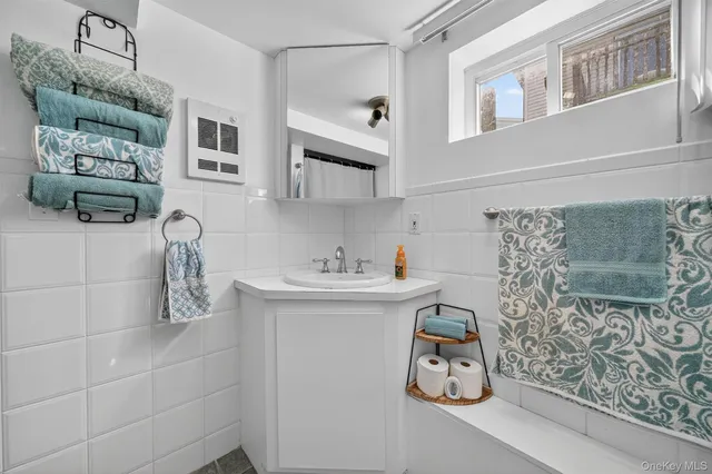 a bathroom with a sink and mirror