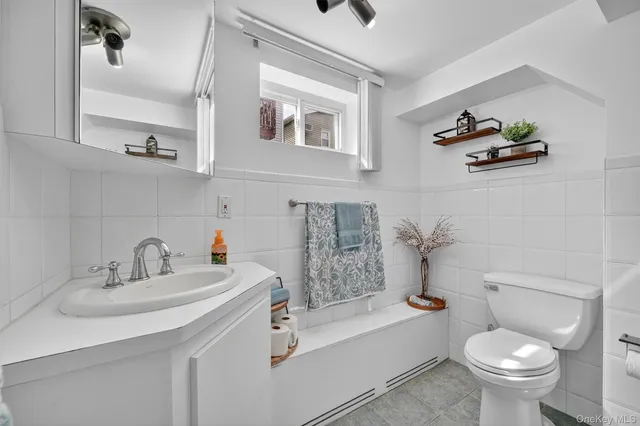 a bathroom with a sink toilet and bathtub