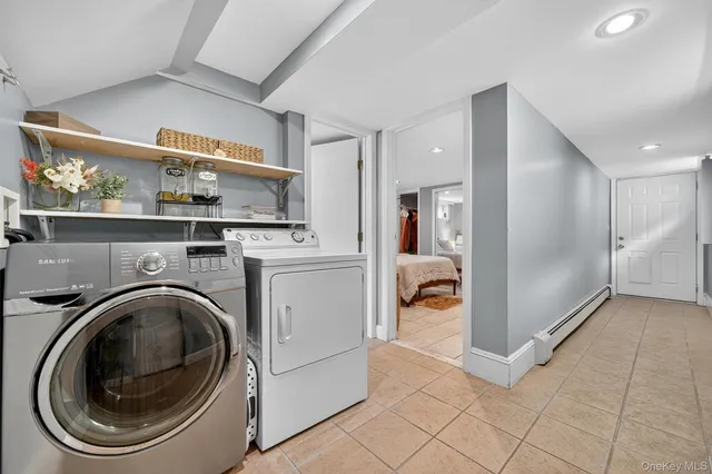 a view of a hallway with washer and dryer