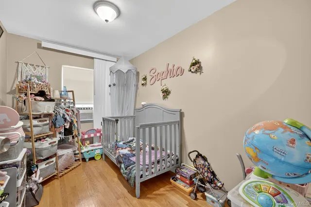 a bedroom with furniture and a wooden floor