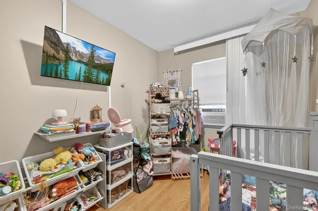 a bed room with furniture and a flat screen tv