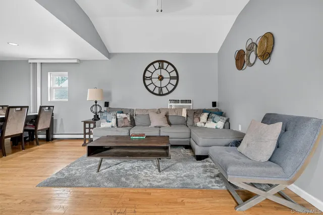 a living room with furniture and a table