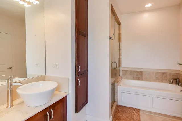 a bathroom with a bathtub and a shower