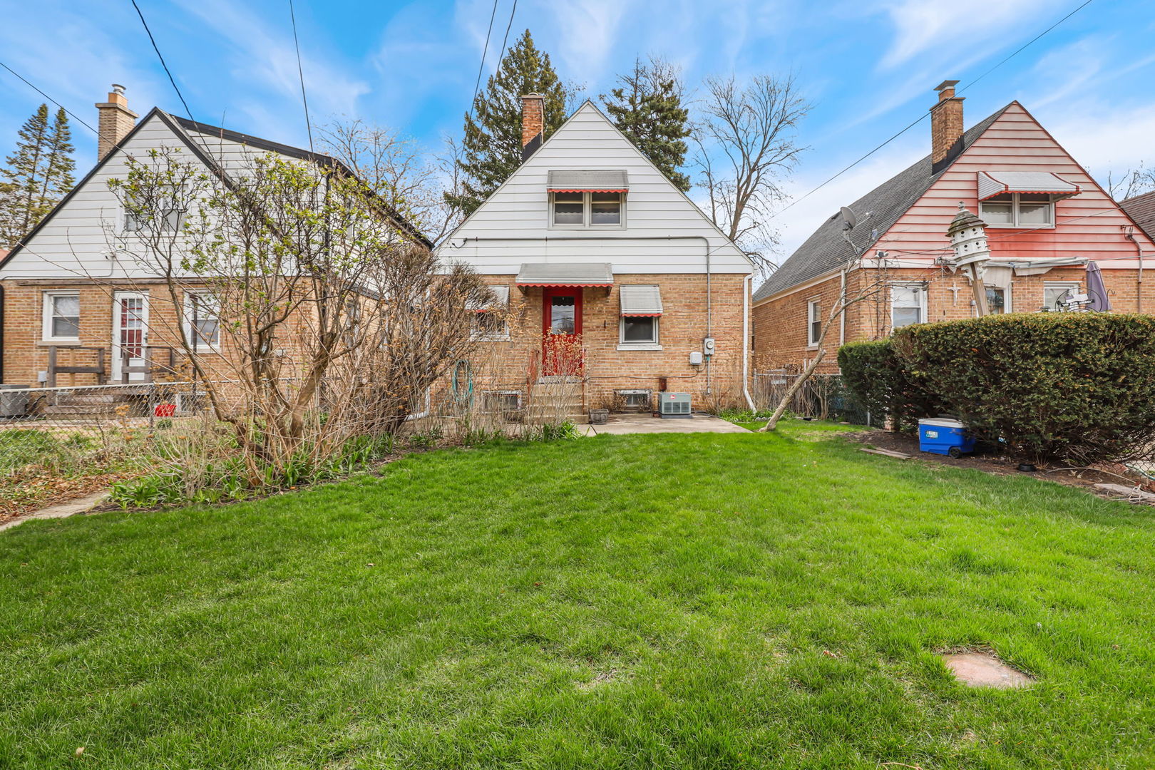 1822 23rd Avenue Melrose Park, IL 60160 - Photo 15 of 20 a front view of a house with a garden and plants