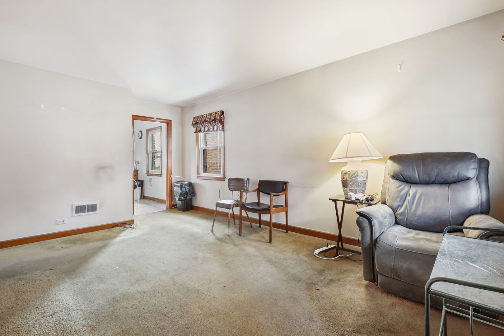 1822 23rd Avenue Melrose Park, IL 60160 - Photo 3 of 20 a living room with furniture and a window