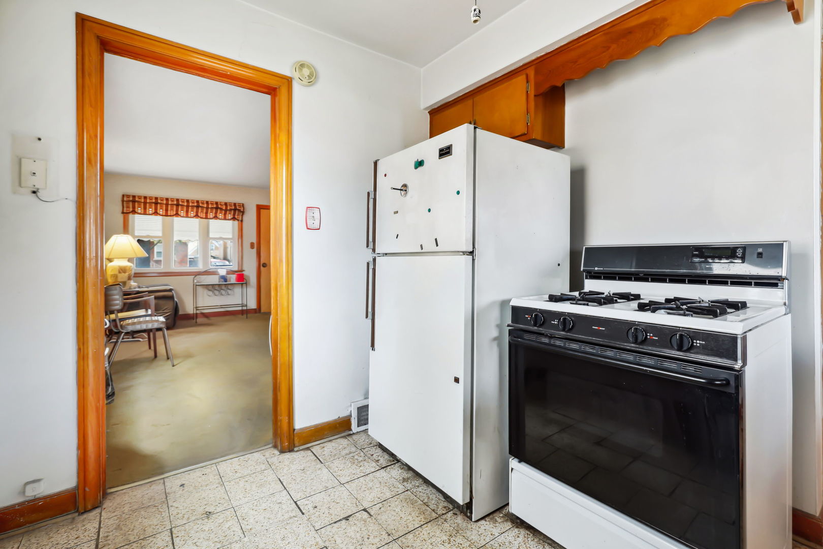 1822 23rd Avenue Melrose Park, IL 60160 - Photo 5 of 20 a kitchen with a stove and a refrigerator