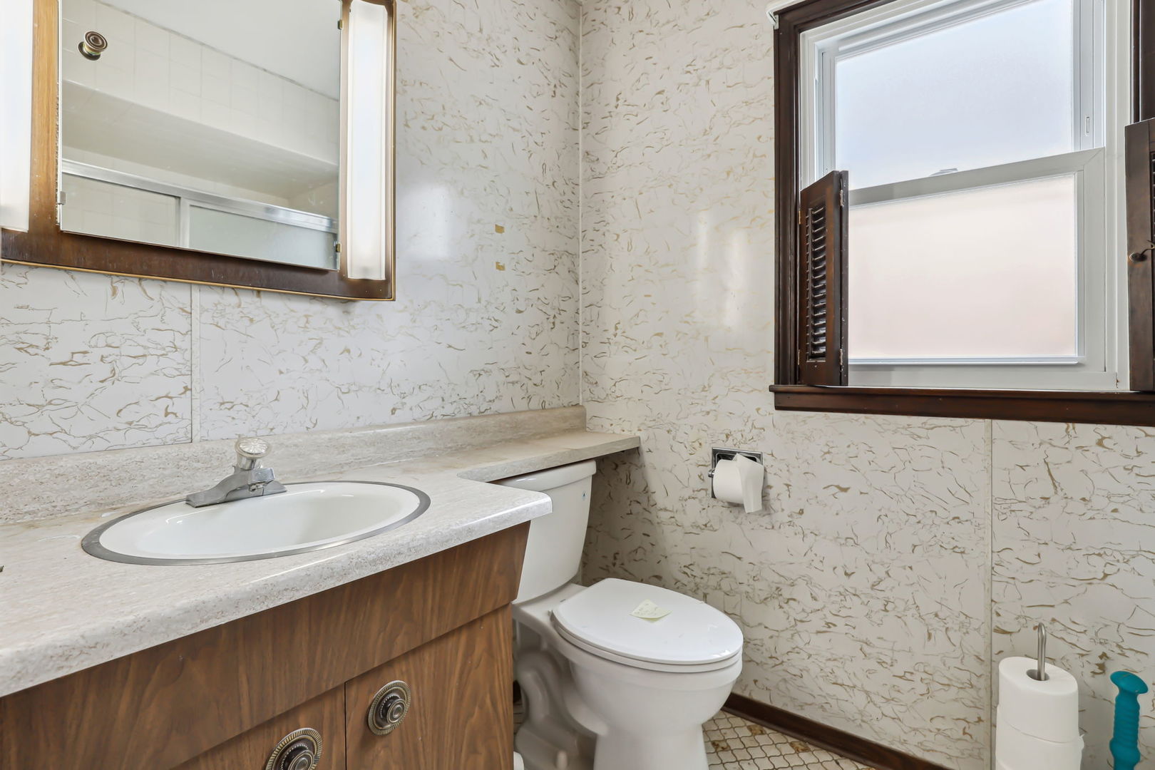 1822 23rd Avenue Melrose Park, IL 60160 - Photo 10 of 20 a bathroom with a sink a toilet and mirror