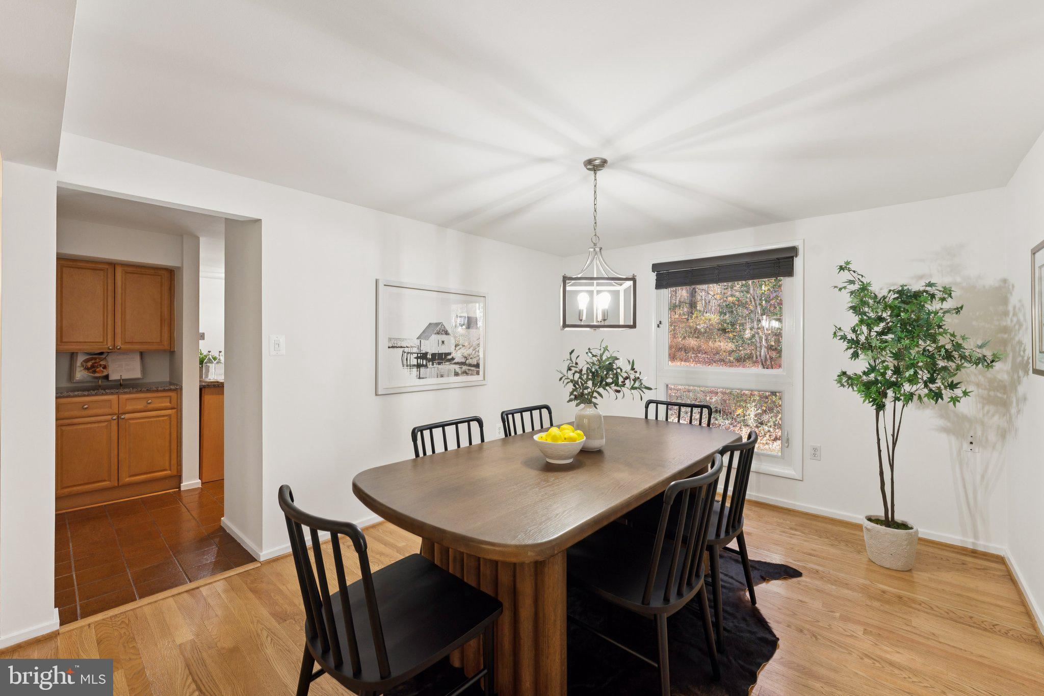 11234 Hunting Horn Lane Reston, VA 20191 - Photo 14 of 44 a view of a dining room with furniture and wooden floor