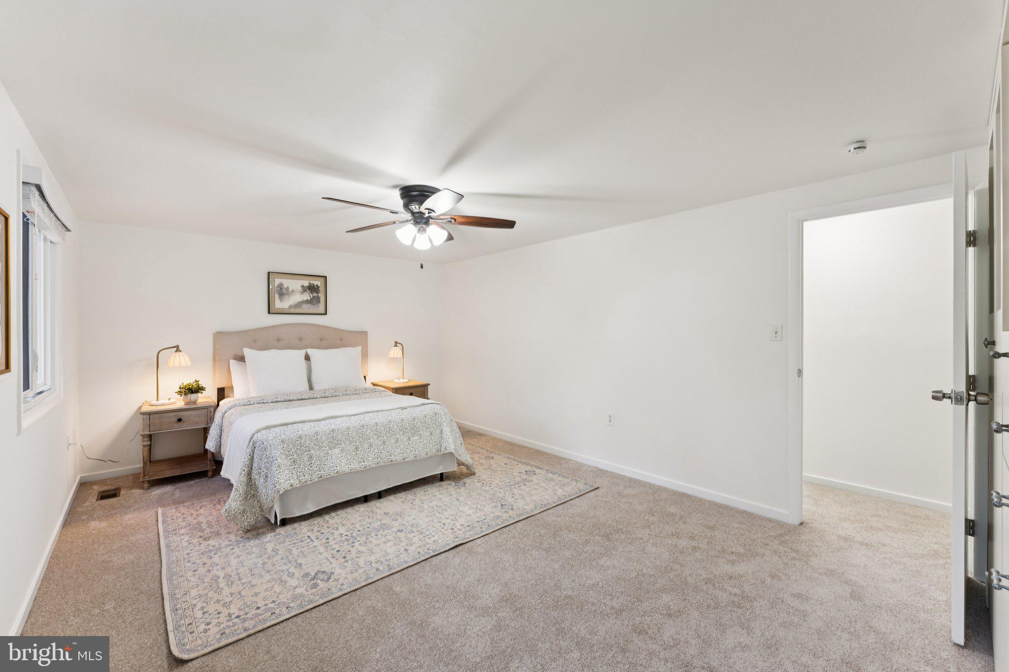 11234 Hunting Horn Lane Reston, VA 20191 - Photo 23 of 44 a bedroom with bed and a chandelier